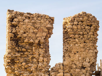 Stone wall against clear sky