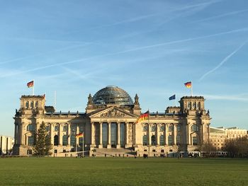 Facade of reichstag building against sky