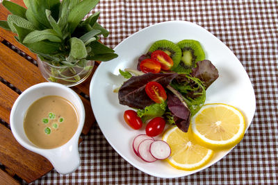 High angle view of fruits in plate on table