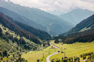 Scenic view of landscape and mountains against sky