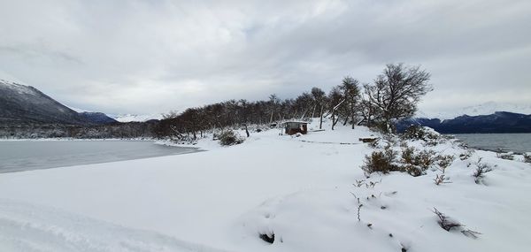 Scenic view of snow covered mountains against sky