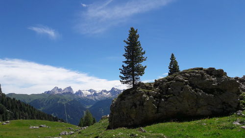 Scenic view of mountains against blue sky