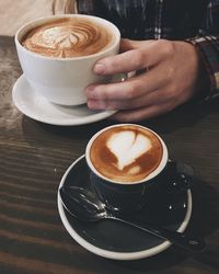 Close-up of woman holding coffee cup