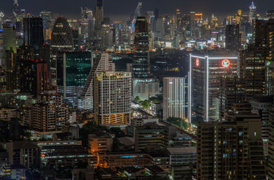 High angle view of illuminated buildings in city at night