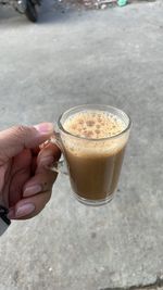 Cropped hand of person holding coffee