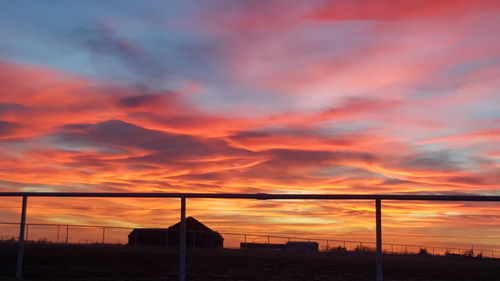 Scenic view of dramatic sky at sunset