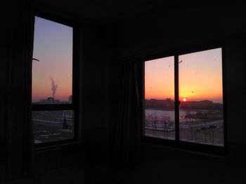 View of sunset through window
