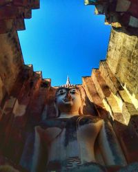 View of temple against clear blue sky