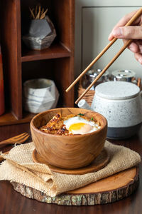 Midsection of person having breakfast