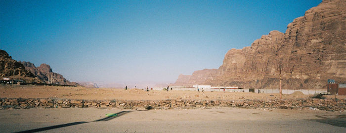 Scenic view of mountains against blue sky