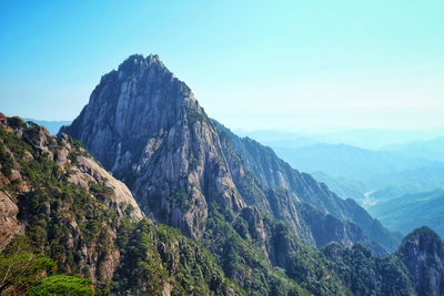 Scenic view of rocky mountains against clear sky