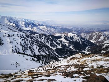 Scenic view of snowcapped mountains against sky