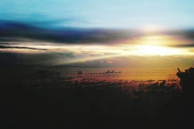 Scenic view of landscape against cloudy sky