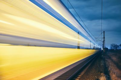 Blurred motion of train on railroad track