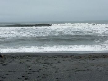 Scenic view of beach against sky