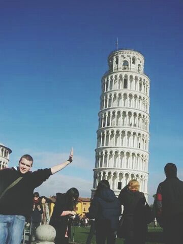 lifestyles, men, leisure activity, architecture, clear sky, built structure, large group of people, building exterior, blue, person, tourism, photographing, famous place, tourist, copy space, travel, travel destinations, sky, international landmark