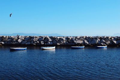 Scenic view of sea against clear blue sky