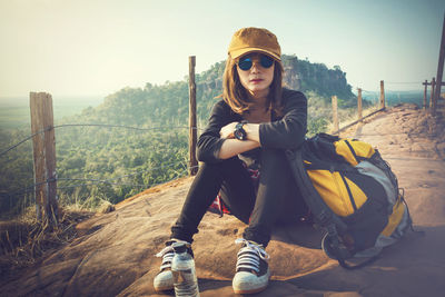 Portrait of smiling young woman wearing sunglasses