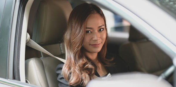 Portrait of woman in car