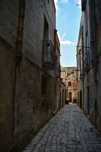 Alley amidst buildings in city