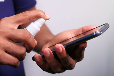 Close-up of man using mobile phone