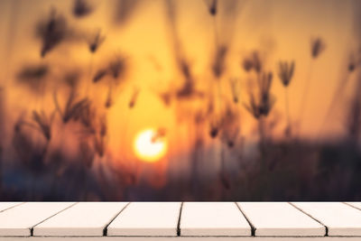 Close-up of roof against orange sky