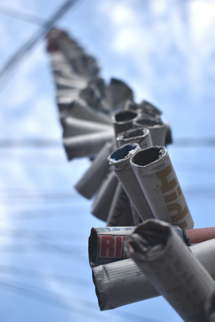 human hand, human body part, one person, close-up, focus on foreground, holding, outdoors, real people, day, sky, time, coin-operated binoculars, people