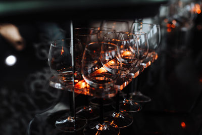 Close-up of wine glasses in darkroom