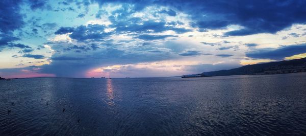 Scenic view of sea against dramatic sky