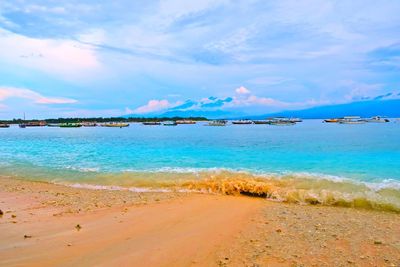 Scenic view of sea against cloudy sky