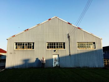 Low angle view of buildings against clear blue sky
