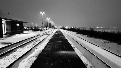 View of illuminated street lights at night