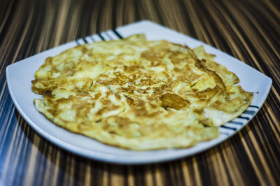 Close-up of omelet in plate on table