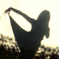 Shadow of hand on silhouette person