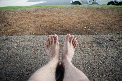 Low section of man standing on floor