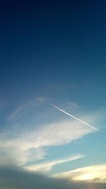 Low angle view of vapor trails in sky