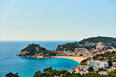 Scenic view of sea against clear blue sky