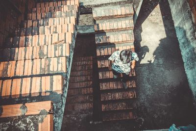 High angle view of man walking on stairs