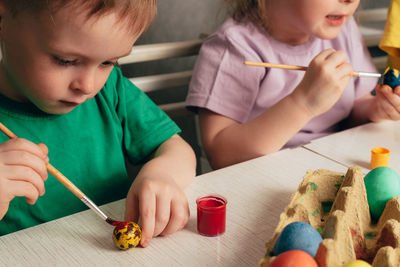 Boy painting at home