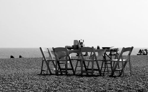 Lifeguard hut on beach against clear sky