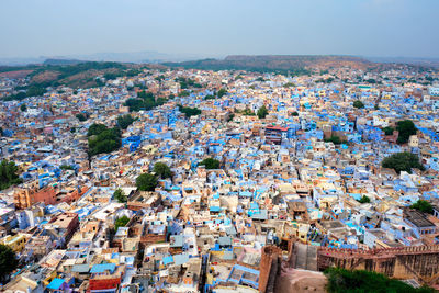 Aerial view of cityscape against sky