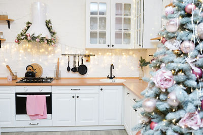 Interior light kitchen with pink christmas decor and lights
