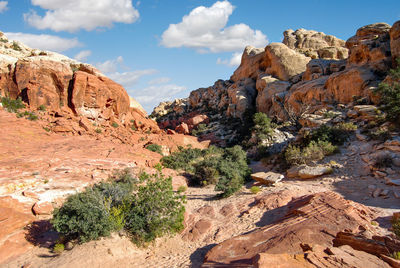 Scenic view of rocks and mountains against sky