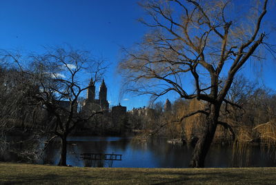 Lake in central park by the eldorado against sky