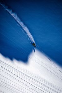 Person skiing on snowcapped mountain