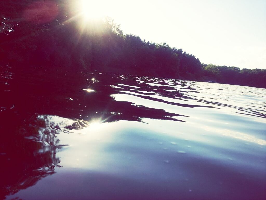 sun, sunbeam, water, reflection, sunlight, tranquility, tranquil scene, lens flare, tree, beauty in nature, scenics, nature, lake, bright, clear sky, sunny, waterfront, sky, river, idyllic