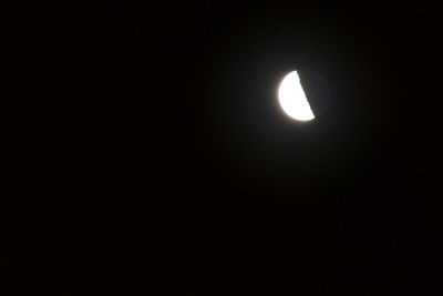 Low angle view of moon against sky at night