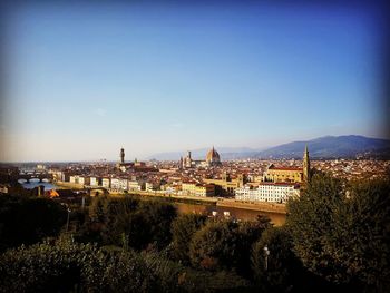 High angle view of city buildings against clear sky