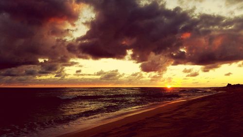 Scenic view of sea against cloudy sky