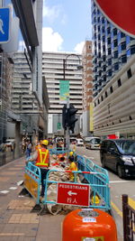 People in city against sky